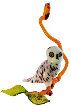 Hängevogel, Schneeeule auf Ast